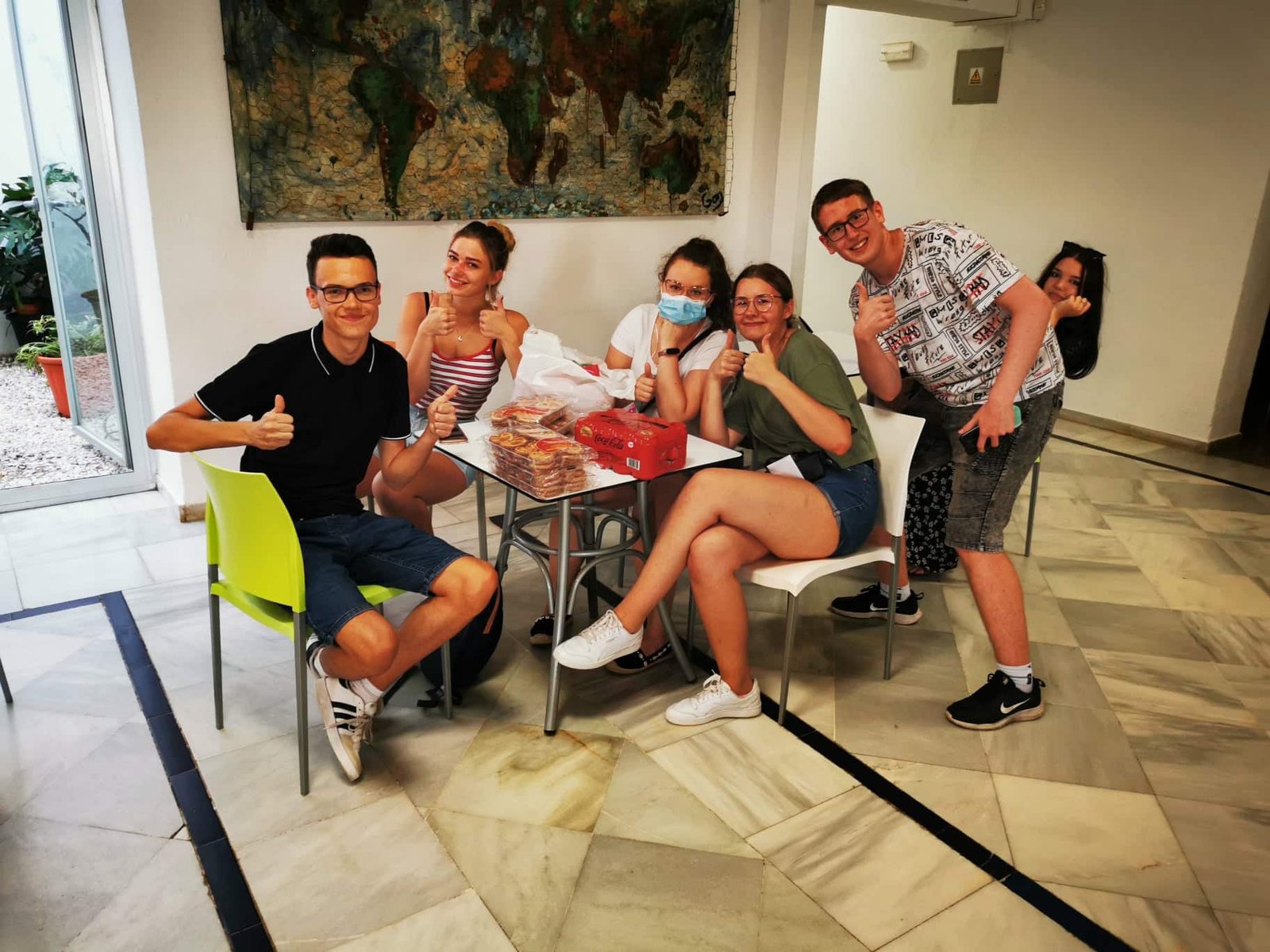 People taking a photo while sitting at the table